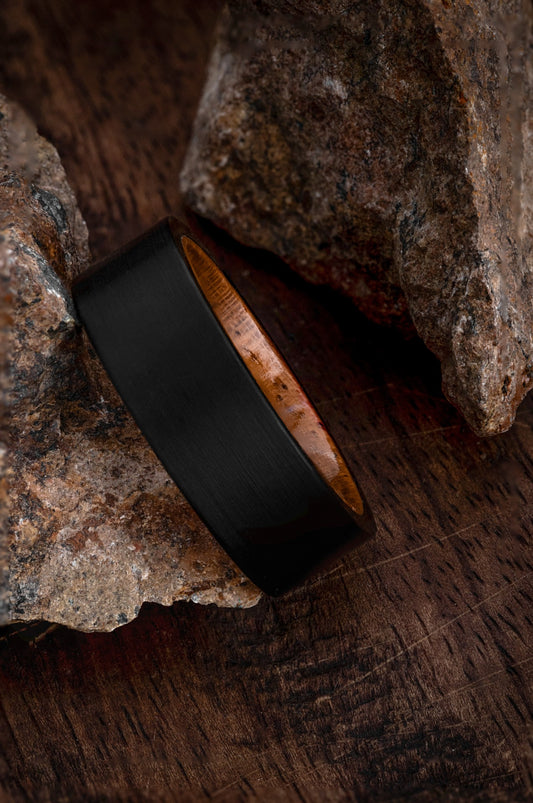The Rigel black tungsten ring featuring a genuine California redwood inlay.