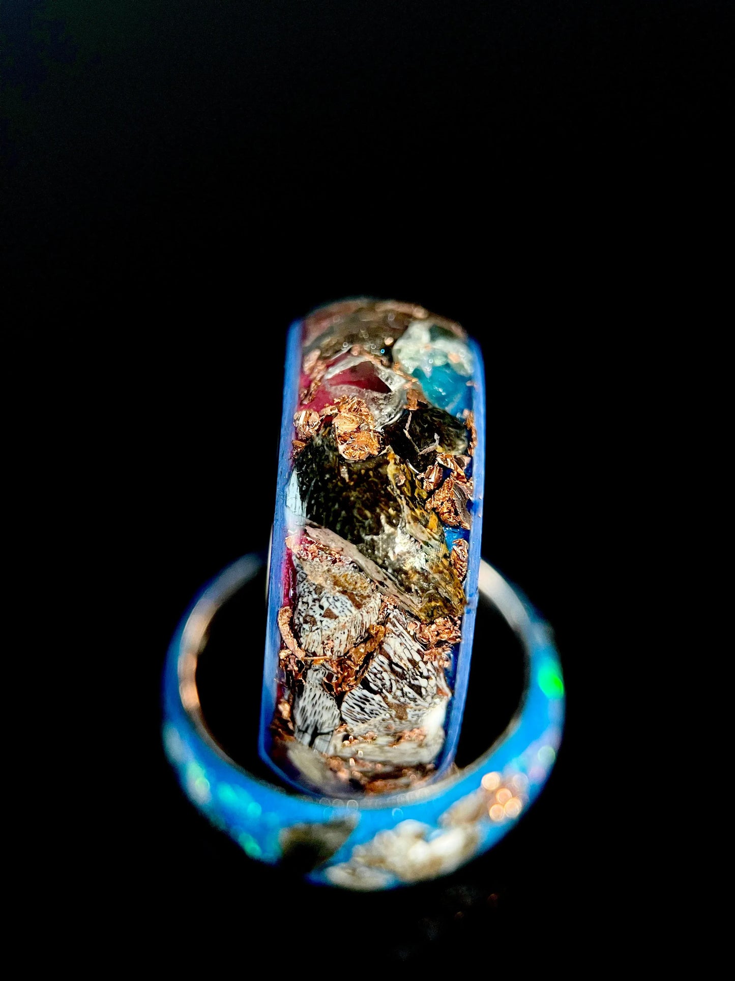 Regalia Rings The Eurus featuring meteorite, dinosaur bone, amethyst, and tellurium copper in a unique ring design.