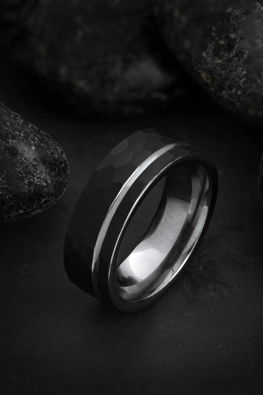 Regalia Rings Hermes black tungsten and silver ring with hammered finish, offset grey inlay, and polished silver interior.