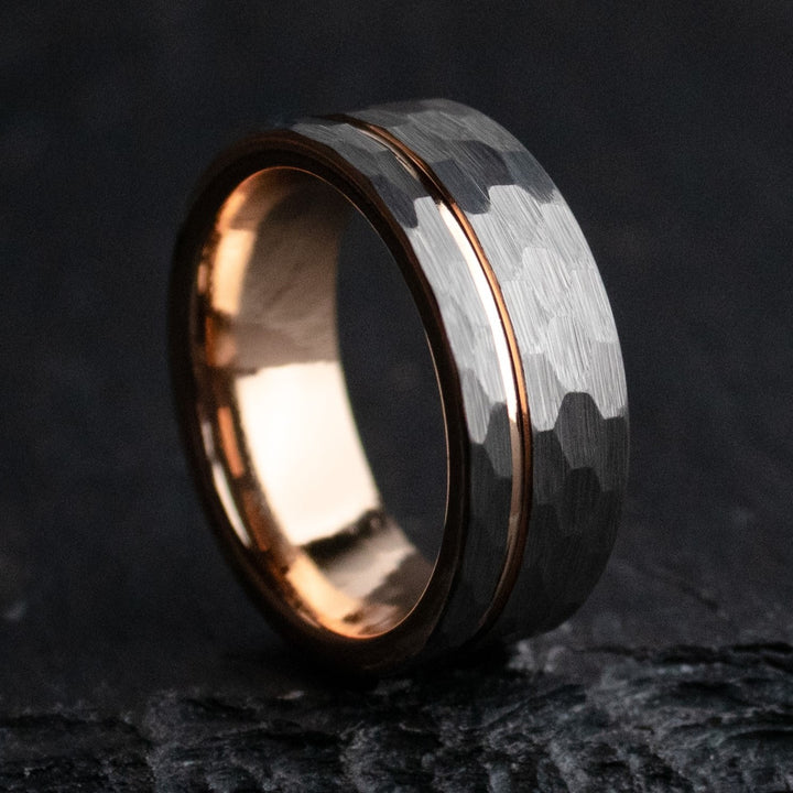 Rustic hammered gray tungsten carbide with rose gold coated inlay and interior