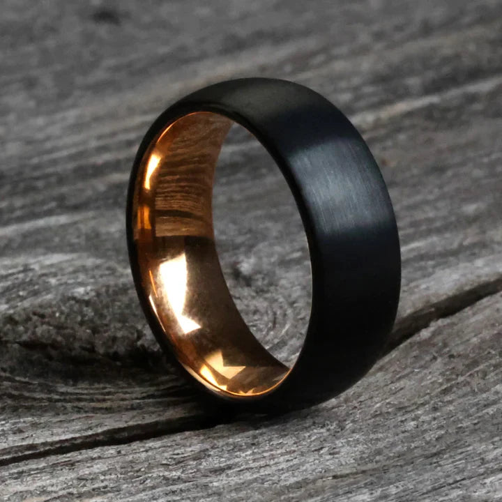 Tungsten Carbide brushed black exterior and polished rose gold interior.