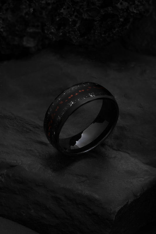 The Fossil Star tungsten ring featuring a crushed inlay of dinosaur teeth enamel and meteorite.