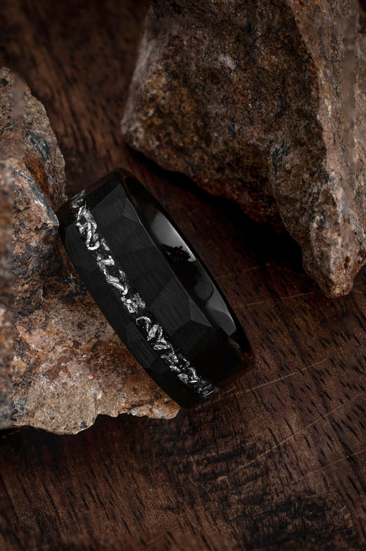 The Dionysus black tungsten ring featuring a crushed Gibeon meteorite inlay.