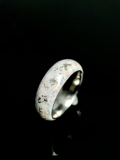 Man wearing The Phobos unique wedding band with meteorite and opal on ring finger.
