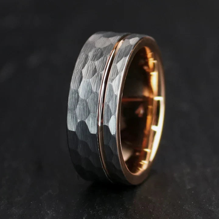 Rustic hammered gray tungsten carbide with rose gold coated inlay and interior