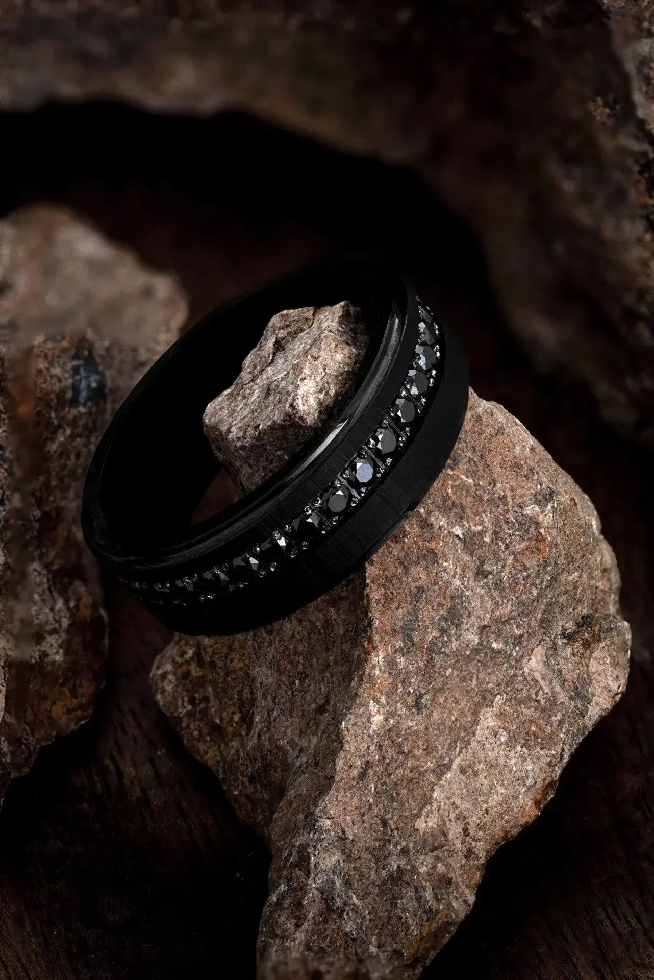 Matte black tungsten ring called The Achilles by Regalia Rings, showcasing a sleek, durable design of strength and modern style.