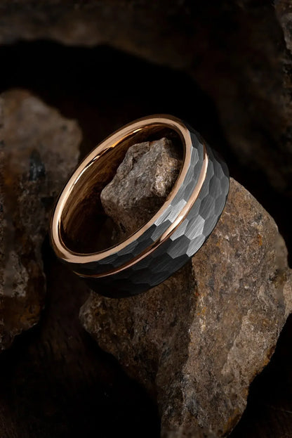 Hammered tungsten men's ring with gold channel by Regalia Rings, featuring a textured finish and sleek gold inlay design.