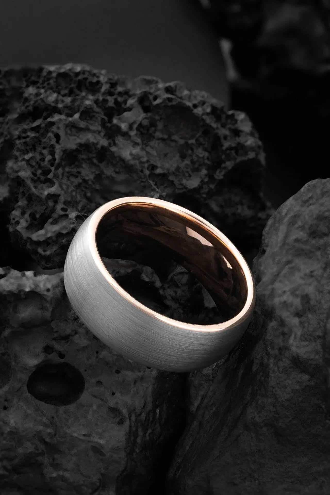 Grey tungsten ring with gold accents from The Erebus collection, featuring elegant and modern design.