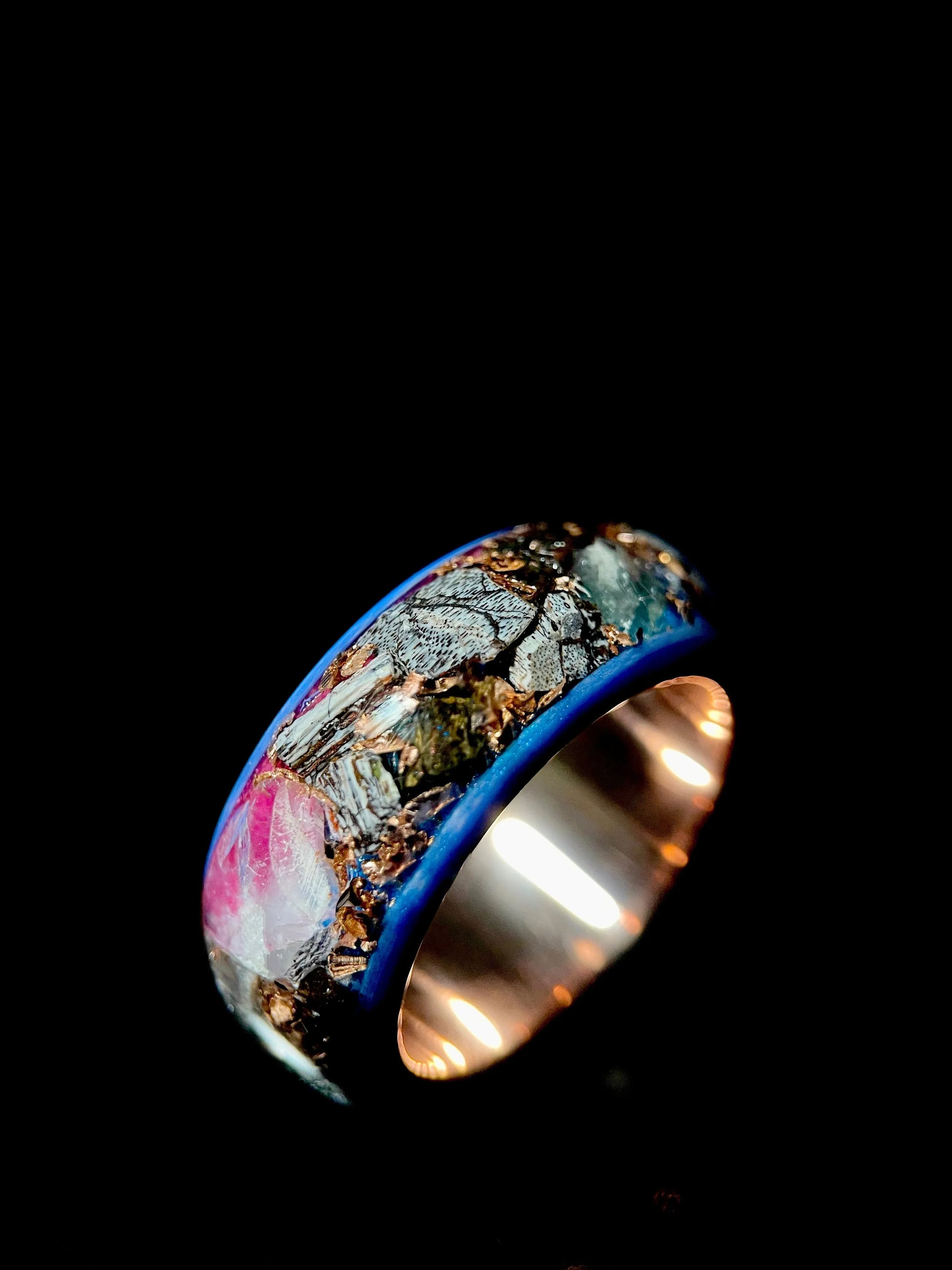 Regalia Rings The Eurus featuring meteorite, dinosaur bone, amethyst, and tellurium copper in a unique jewelry design.