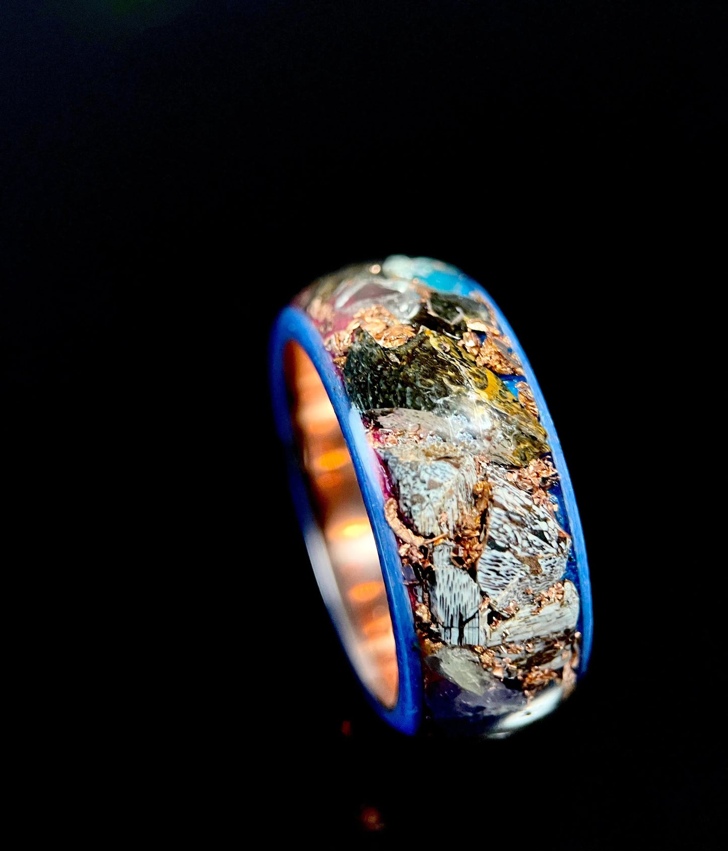 Regalia Rings The Eurus featuring meteorite, dinosaur bone, amethyst, and tellurium copper in a unique jewelry design.