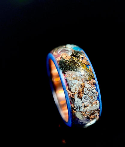 Regalia Rings The Eurus featuring meteorite, dinosaur bone, amethyst, and tellurium copper in a unique jewelry design.