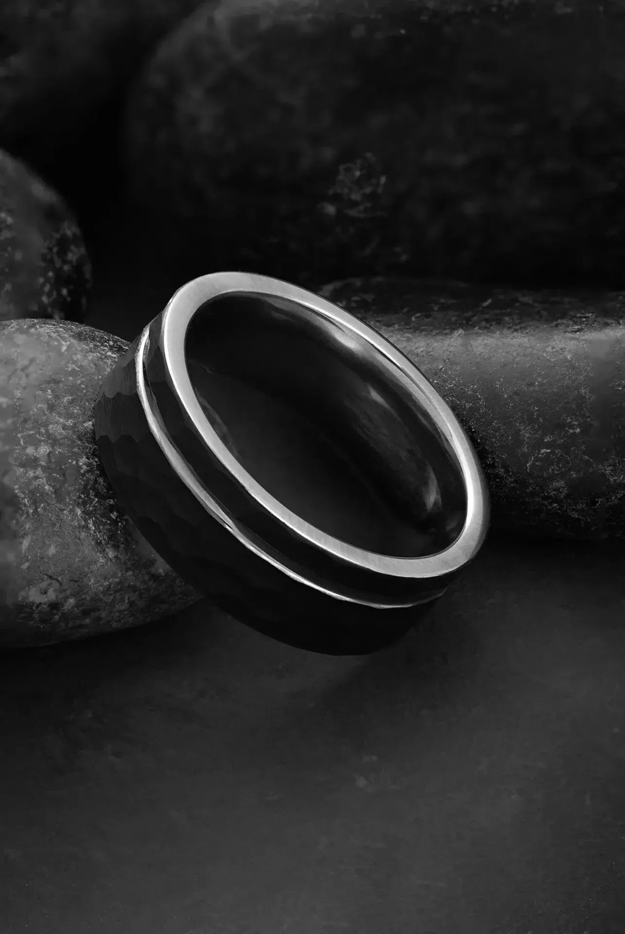 Close-up of The Hermes black tungsten and silver ring by Regalia Rings, showcasing its modern design and sleek finish.