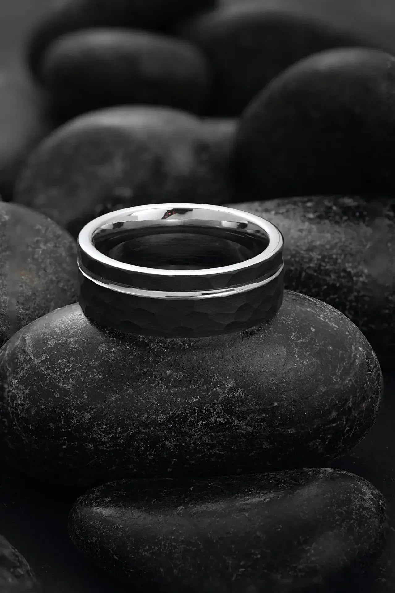 Close-up of Regalia Rings' Hermes modern black tungsten and silver ring featuring sleek design and timeless style.
