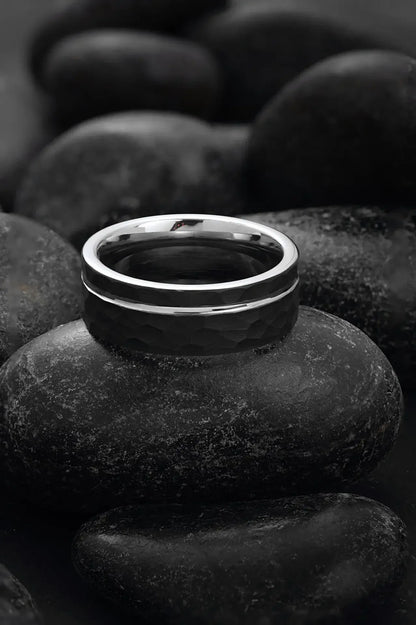 Close-up of Regalia Rings' Hermes modern black tungsten and silver ring featuring sleek design and timeless style.