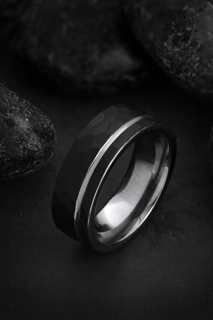 Regalia Rings Hermes black tungsten and silver ring with hammered finish, offset grey inlay, and polished silver interior.