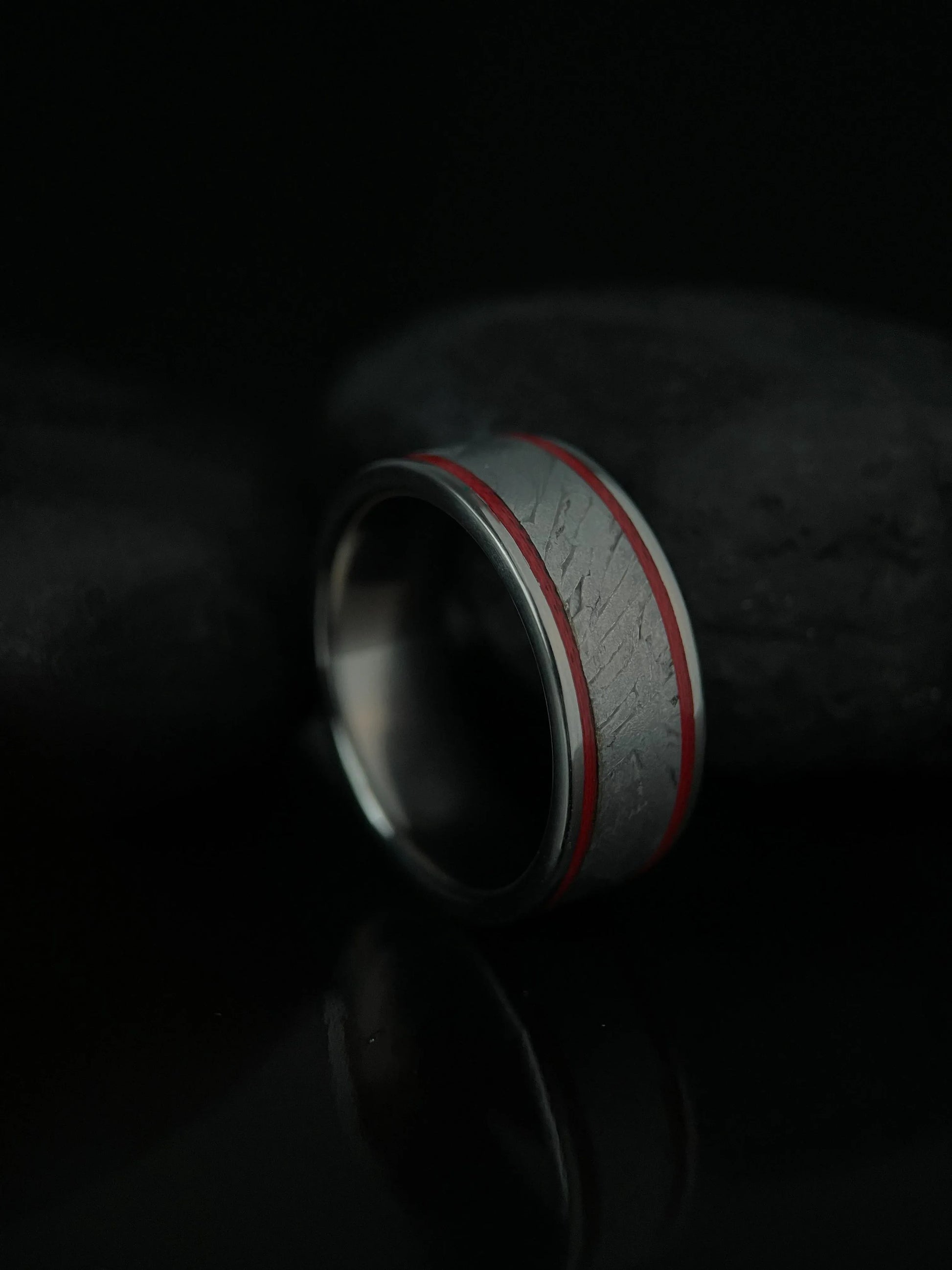 The Orion ring by Regalia Rings features Muonionalusta meteorite inlaid in titanium Grade 5, showcasing a sleek, modern design.