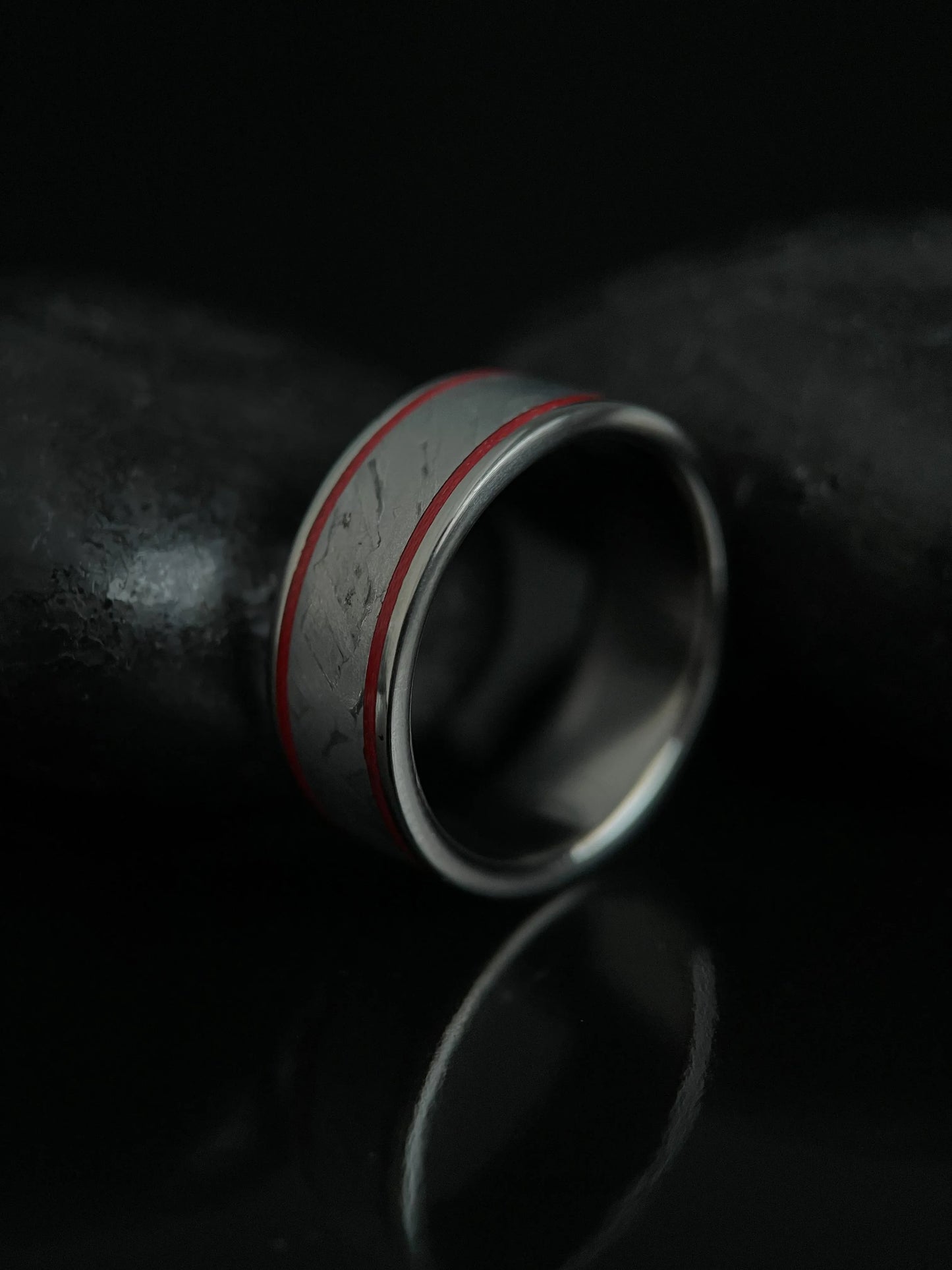 Close-up of The Orion ring featuring Muonionalusta meteorite and titanium Grade 5 band by Regalia Rings, showcasing intricate design.