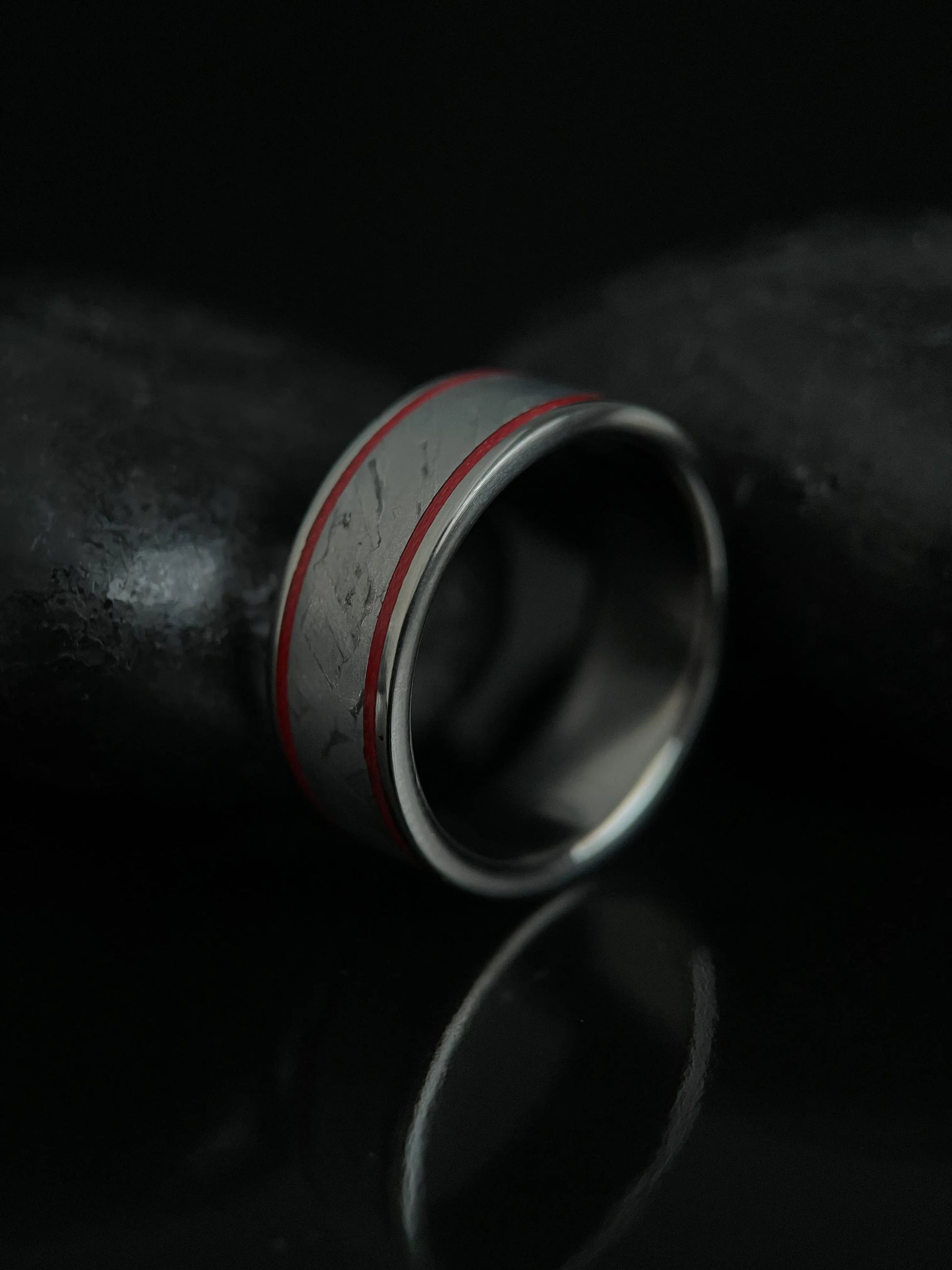 Close-up of The Orion ring featuring Muonionalusta meteorite and titanium Grade 5 band by Regalia Rings, showcasing intricate design.