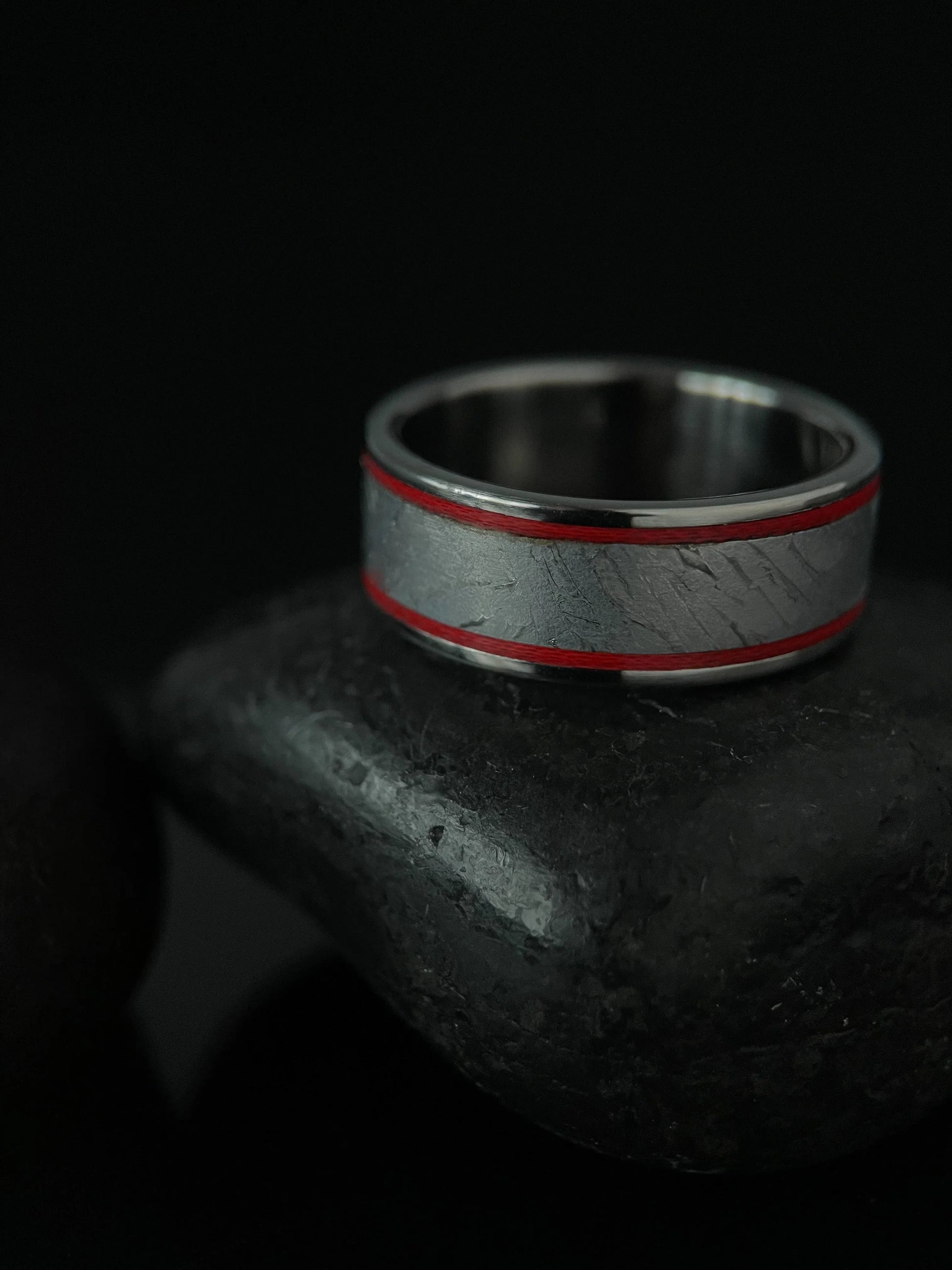 The Orion ring by Regalia Rings featuring Muonionalusta meteorite inlaid with titanium Grade 5, showcasing a sleek, modern design.