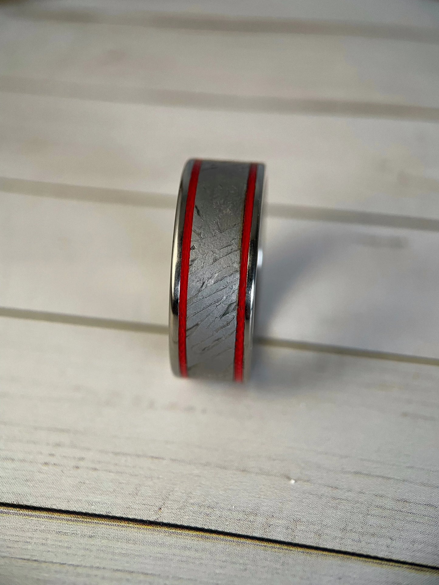 Close-up of The Orion ring by Regalia Rings featuring Muonionalusta meteorite and titanium Grade 5 band.