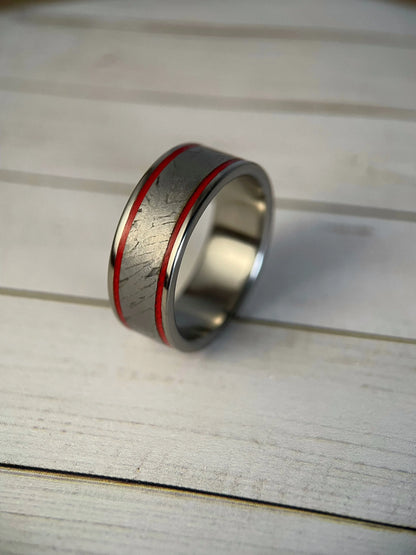 Close-up of The Orion titanium ring by Regalia Rings featuring Muonionalusta meteorite inlaid design and Grade 5 titanium band