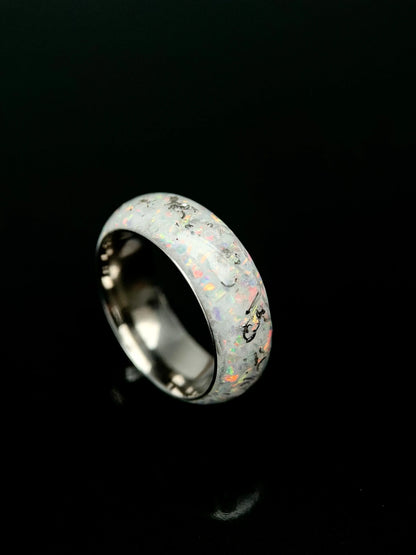 Men's Phobos glow-in-the-dark ring by Regalia Rings with meteorite and opal inlay on a black band.