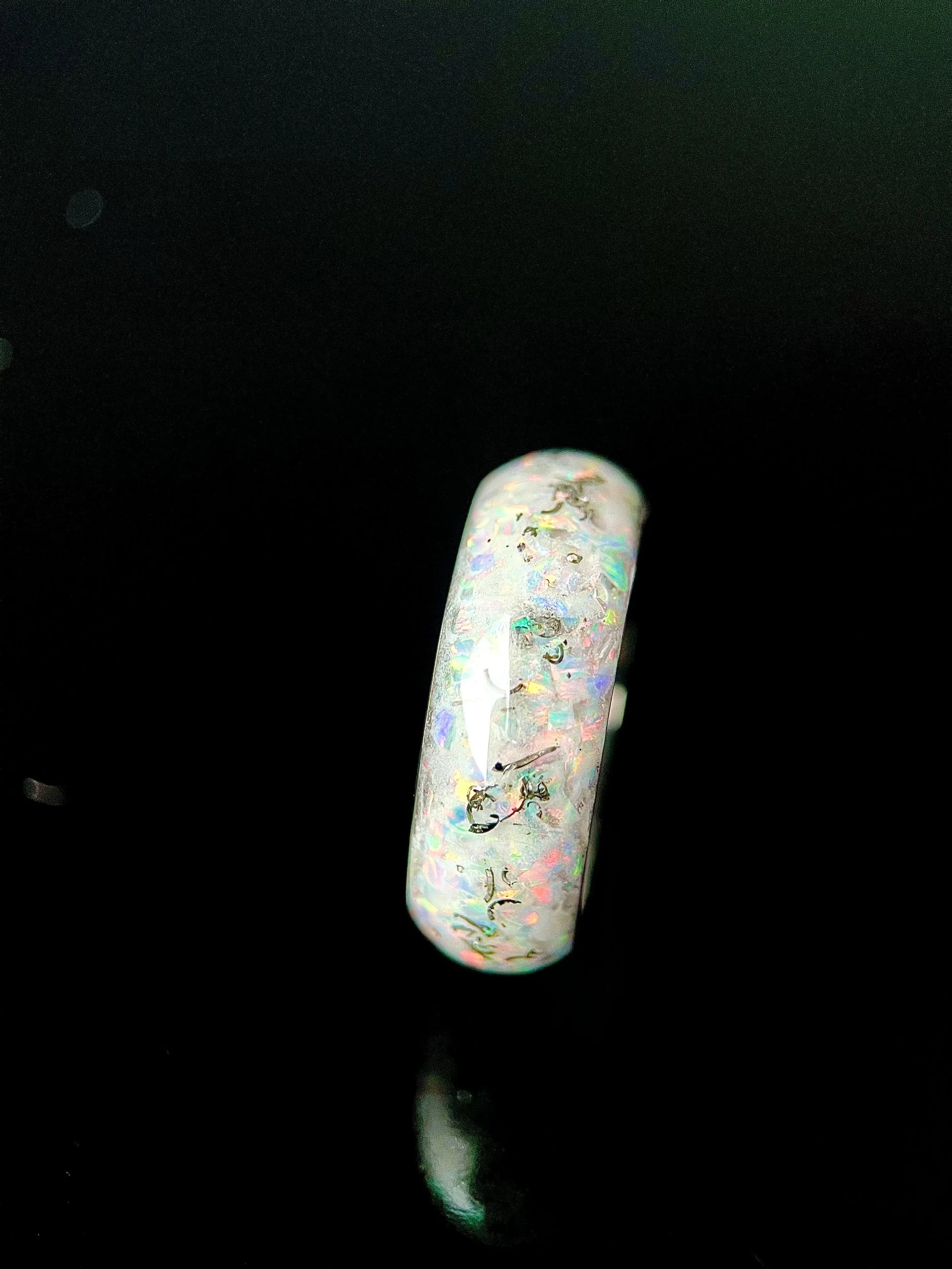 Regalia Rings Phobos glow-in-the-dark ring featuring meteorite and opal accents with a sleek, modern design.