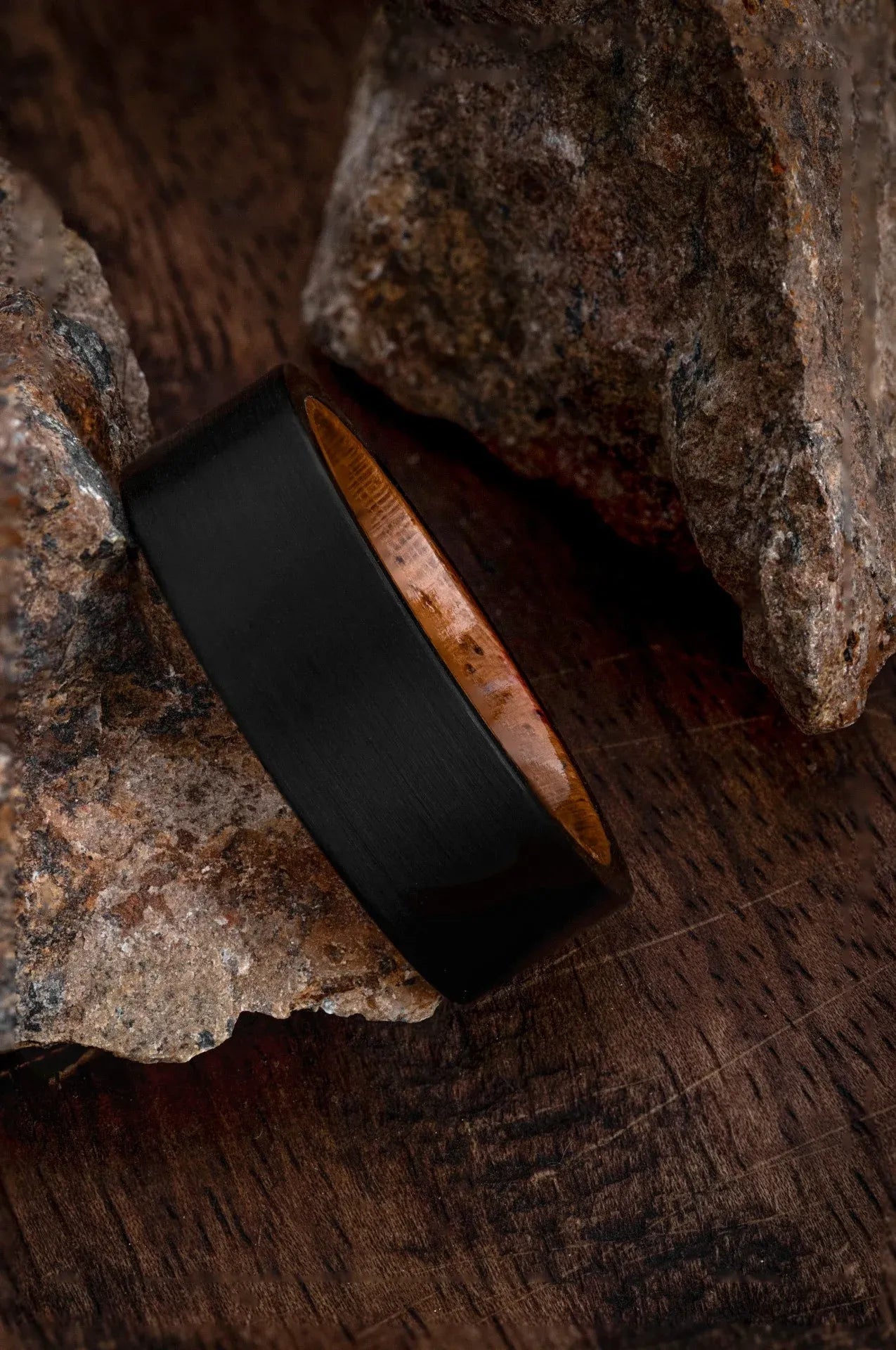Regalia Rings Rigel’s Legacy black tungsten ring with genuine California redwood inlay, showcasing a sleek and modern design.