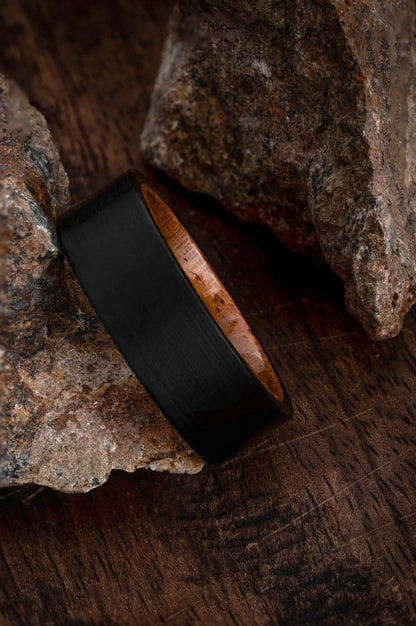 Regalia Rings Rigel’s Legacy black tungsten ring with genuine California redwood inlay, showcasing a sleek and modern design.
