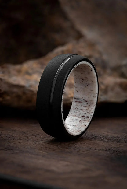 Regalia Rings The Zeus tungsten black ring featuring a deer antler design, showcasing a bold and rugged jewelry style.
