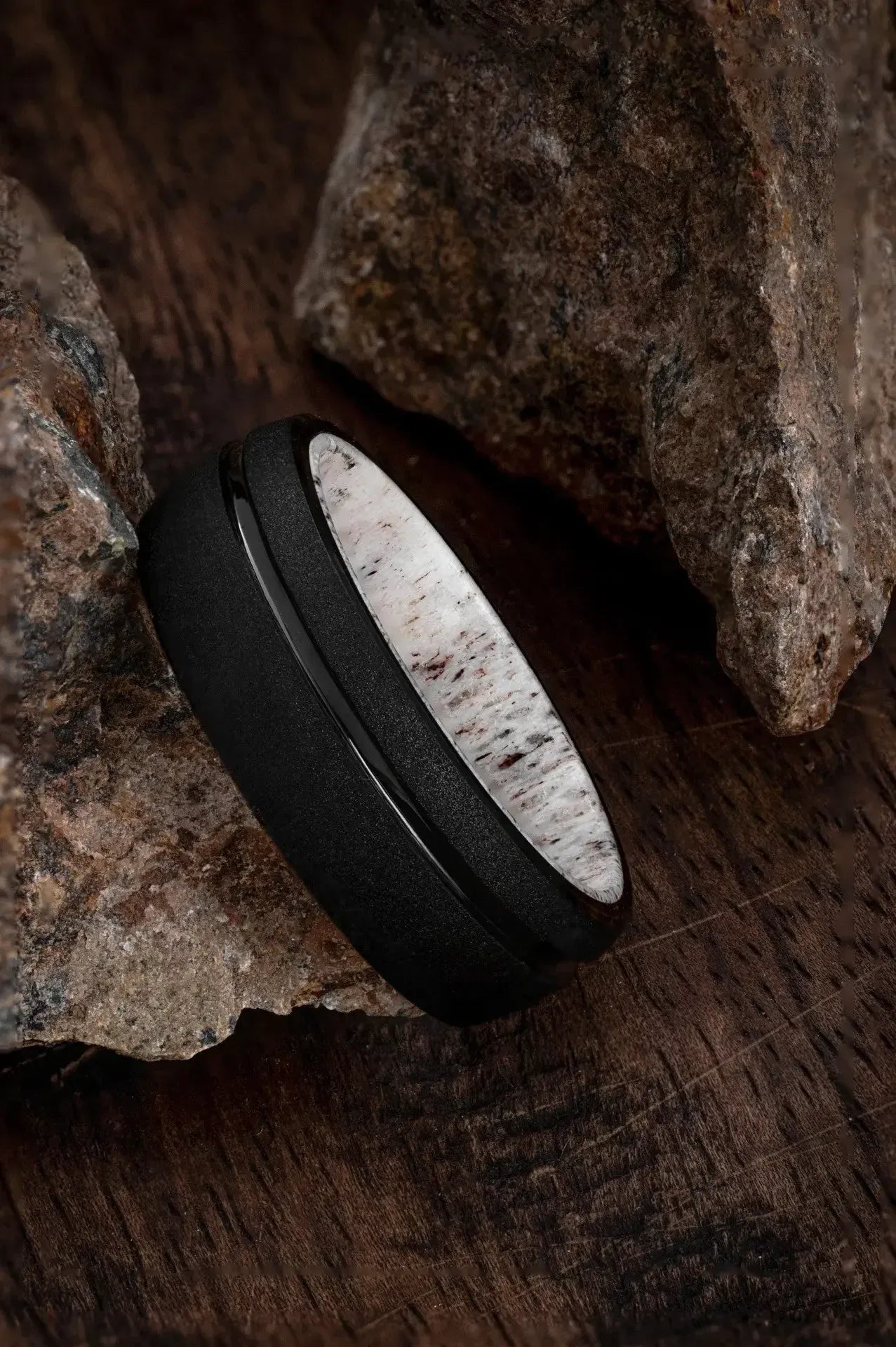 Black tungsten ring with deer antler inlay from Regalia Rings' The Zeus collection, featuring a sleek, modern design.