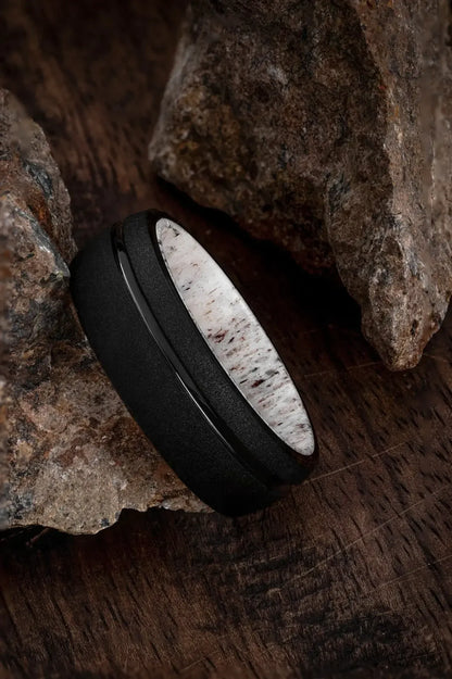 Black tungsten ring with deer antler inlay from Regalia Rings' The Zeus collection, featuring a sleek, modern design.