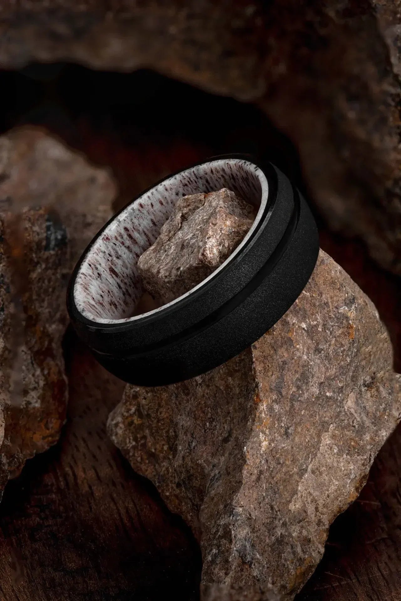 Regalia Rings The Zeus tungsten black ring with a deer antler design, showcasing a bold and rugged men's jewelry piece.