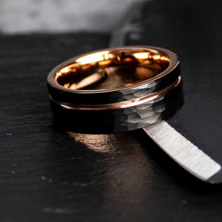 Hammered black Tungsten Carbide pairs with a Rose Gold